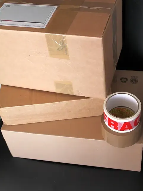 constructed cardboard boxes with a roll of packing tape